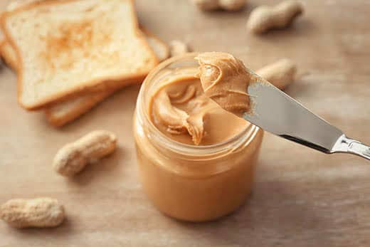 Knife with creamy peanut butter