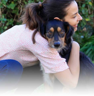 woman with dogs head on her shoulder